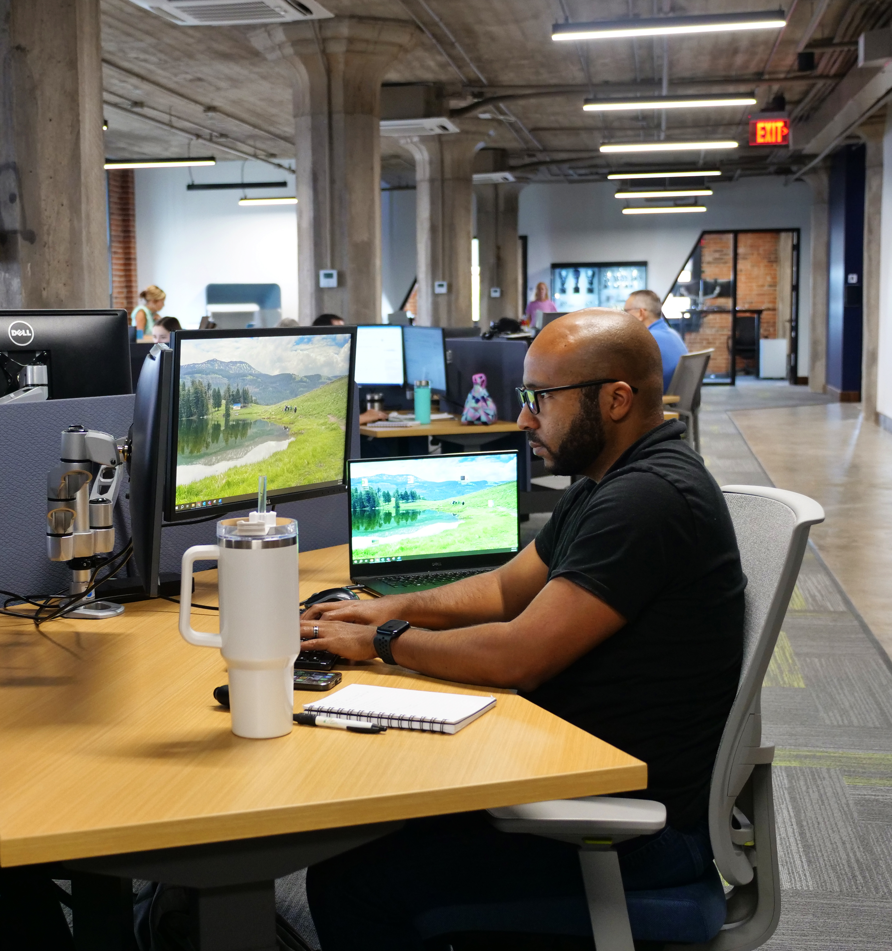 Josh McGee at his desk